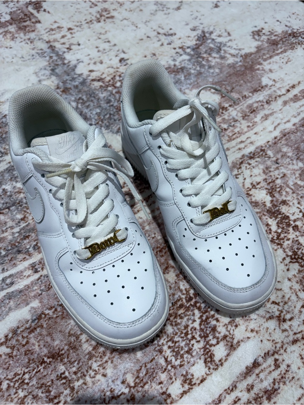 Nike Women’s Air Force 1 with gold shoelace tongue